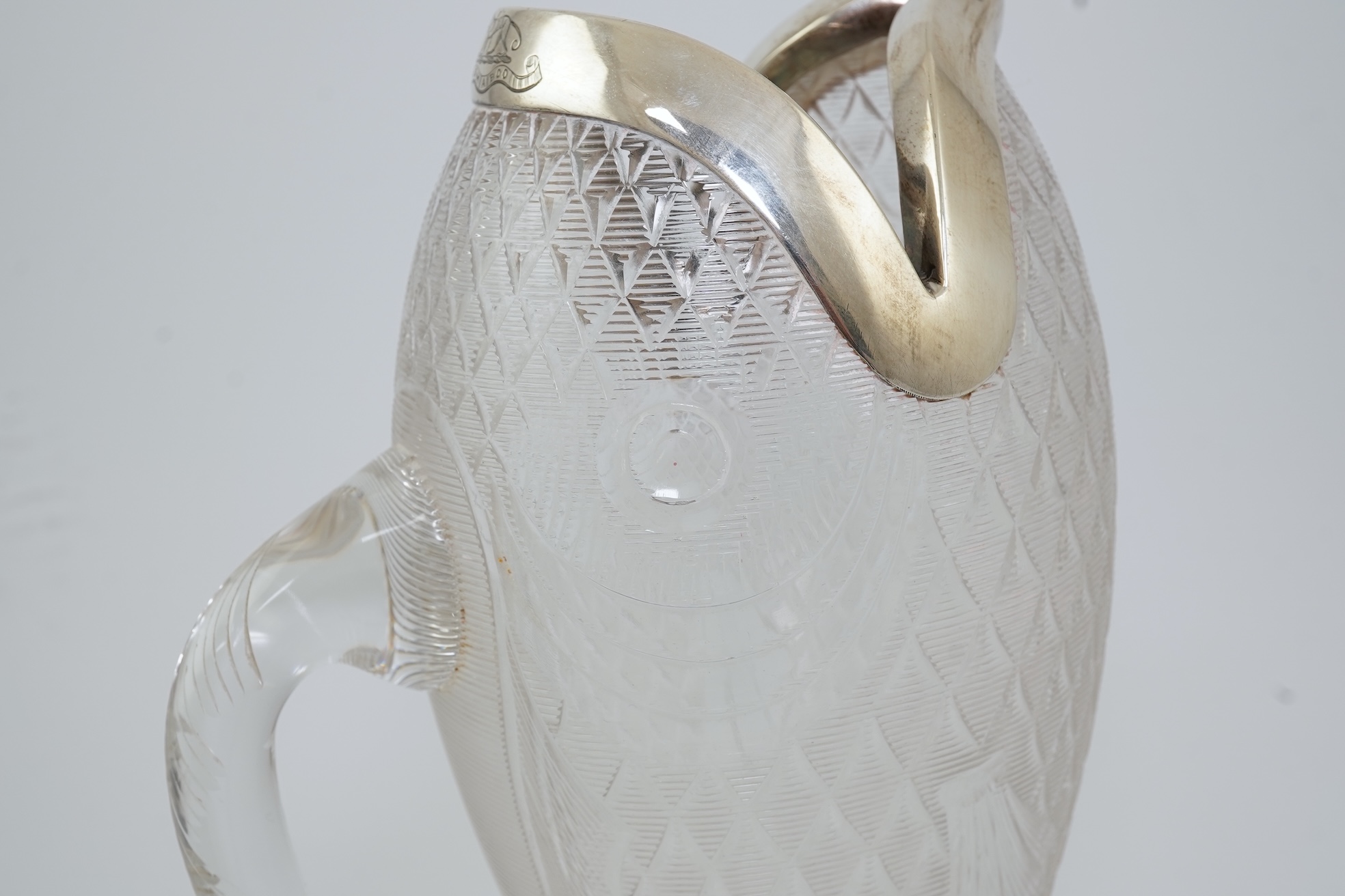 An unusual late Victorian novelty silver mounted single handled cut glass jug, modelled as a fish, by Hukin & Heath